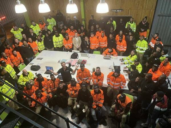 The whole Schmidhauser crew in hi-vis at the morning briefing