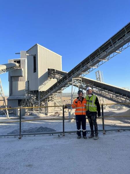 Quarry plant and conveyors with two Schmidhauser staff in hi-vis