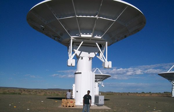 A Schmidhauser technician beneath an SKA radio telescope dish