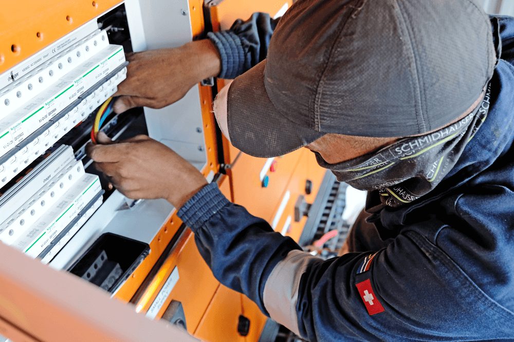 Schmidhauser electrician working on a motor installation